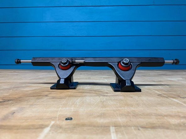 If your having trouble getting the locknut to start threading, make sure the hanger is pushed all the way into the base of the baseplate (where the hanger comes to a rounded point). You can also apply pressure down on the truck to compress the bushings