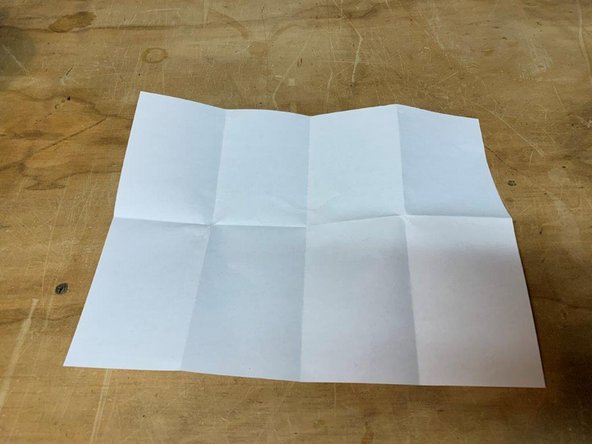 Get a piece of printer paper, and fold it in half three times (so it is 8 pieces thick)