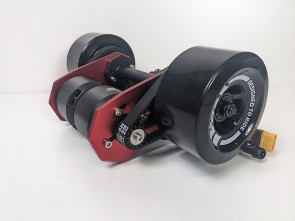 If the belt depresses more than 4mm, there is not enough tension. Loosen the bolt and apply more tension.