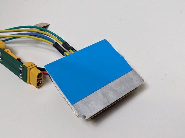 Add thermal tape to cover the entire backside of the ESC. (Here's where you can use that excess material!)