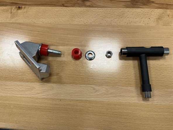 Using the T-Tool, remove the locknut from the baseplate
