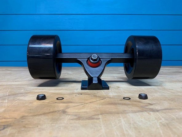 Remove one locknut and one washer from each side of the truck. Make sure there is still one washer on the truck