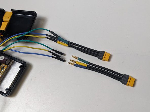 Gather 2 motor cable adaptors, and the Rubber Cable Gaskets that were cut in step 9.