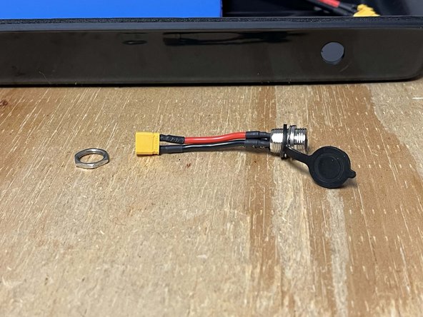 Remove the locknut from the charge port