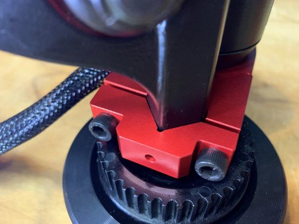 Tighten the bolts on the motor mount A QUARTER TURN at a time. So, tighten the top bolt a quarter turn, bottom bolt a quarter turn, and repeat until the mount is tight. This will make sure you have even pressure on both bolts, there should be an equal gap between the top and bottom of the motor mount (last photo)