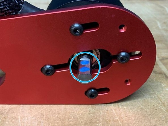 Add two drops of Loctite to each motor shaft