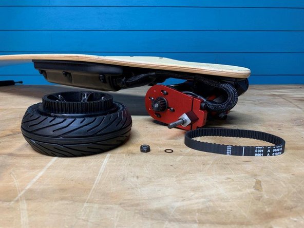 Remove the one washer, locknut, wheel, and belt