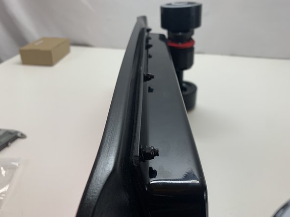 Secure the enclosure with 8x M5x25 bolts, rubber washer, metal washer, and locknut. Make sure the rubber washer is against the enclosure with a metal washer and locknut on top of it.