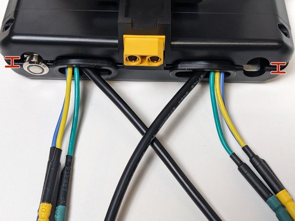 Lift the bottom case (side with PCB) by the corners and lower the case evenly on all corners.