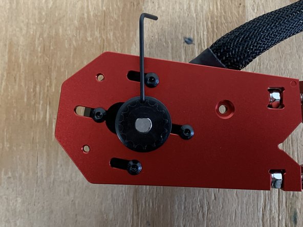 It is a tight fit and need to be aligned properly. If the motor pulley only goes part of the way on, use the Allen wrench to loosen the set screw