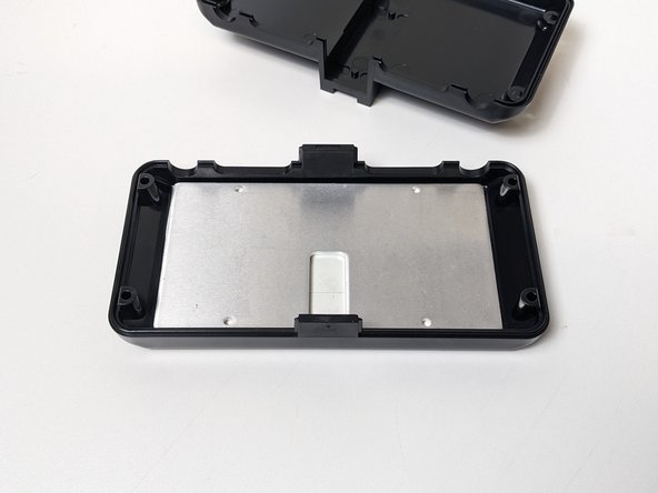 Peel off the thermal tape's backing and install the heatsink into the TOP of the ESC enclosure by pressing firmly on the heatsinks 4 corners.