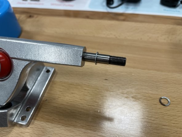 Remove the locknut and one silver spacer from the rear hanger on the side without the extra circular block.