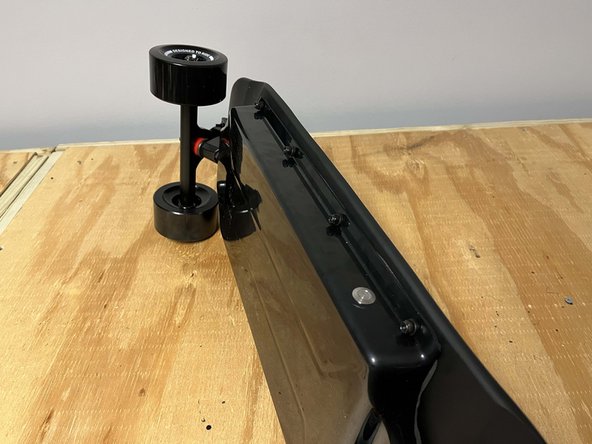 Carefully arrange the enclosure on the deck so it aligns with the holes in the deck