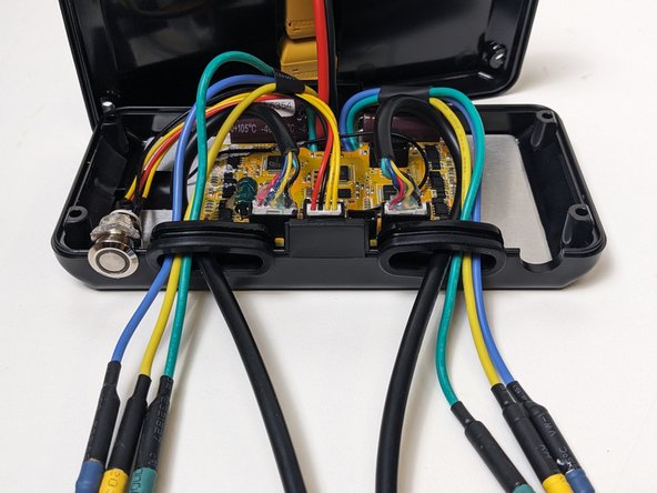 Tuck and pull the cables through to make space in the enclosure.