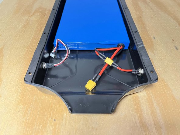 Plug the charge port into the battery