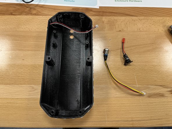 Gather the enclosure, switch, and charge port from section 6