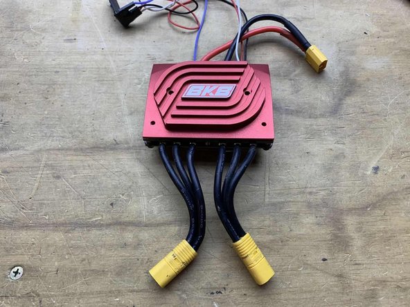 Place the external heatsink on the ESC with the two threaded holes facing downwards towards the motor wires