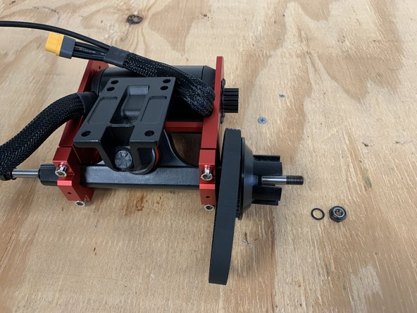 Slide the wheel pulley and belt onto the truck