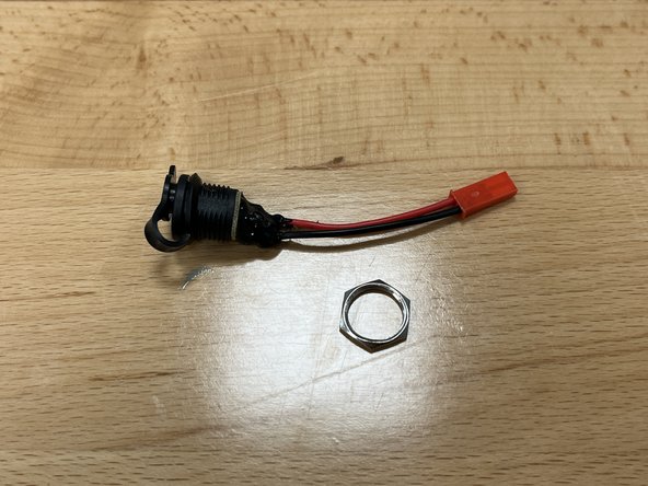 Remove the locknut from the charge port