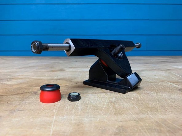 Remove one bushing and washer from each baseplate