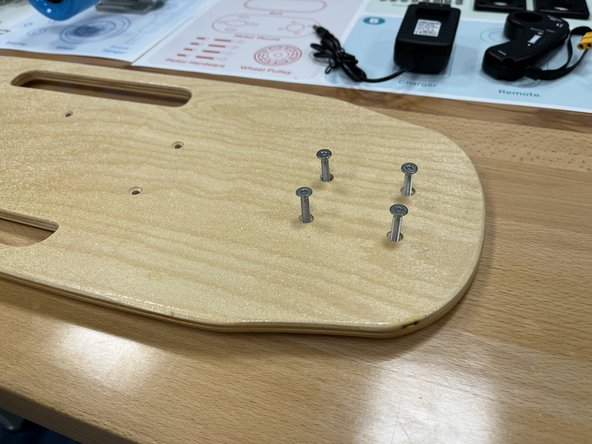 Gather the deck, risers, and truck hardware from section 4