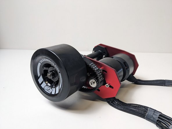 Slide the wheel onto the truck with the words facing outwards