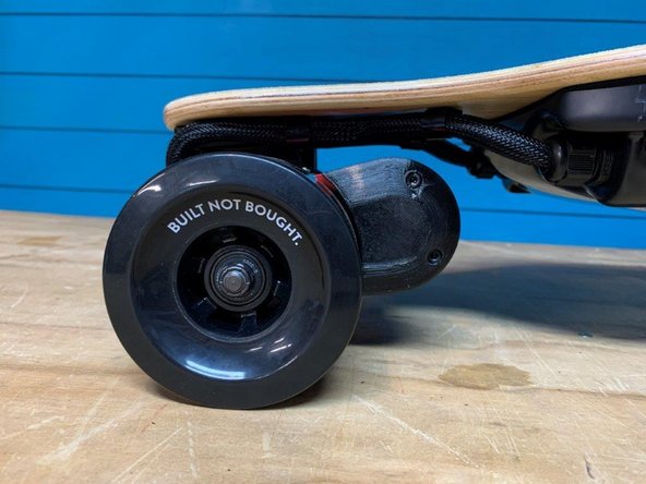 Place the belt guards on the motor mounts and tighten the four screws