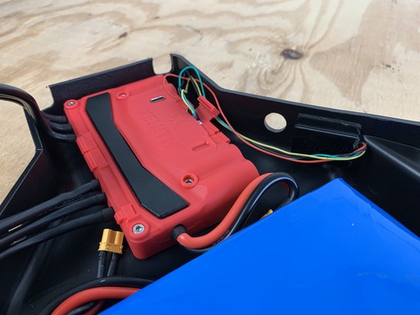 Remove the backing off of the gasket to stick the receiver box to the enclosure