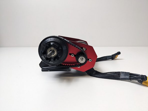 Slide the wheel pulley and belt onto the truck