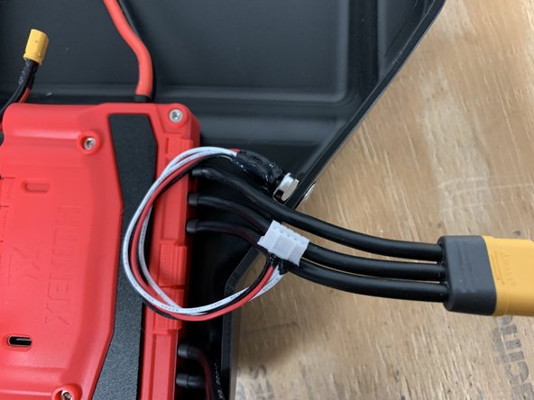 Place the switch in the hole on the right side of the enclsoure