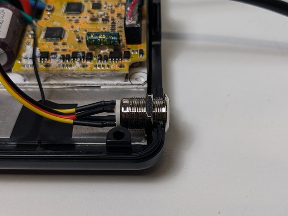 Plug the switch into the compatible port, between the two sensor cables.