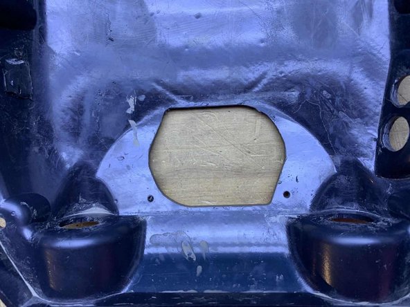 Cut the shape and two holes using your preferred method (Dremel, etc)