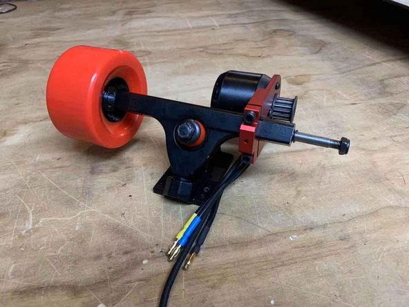 Slide the motor mount assembly onto the other side of the truck as shown