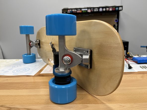 Add the rear truck from section 1 to the bolts, make sure the motor is facing inwards