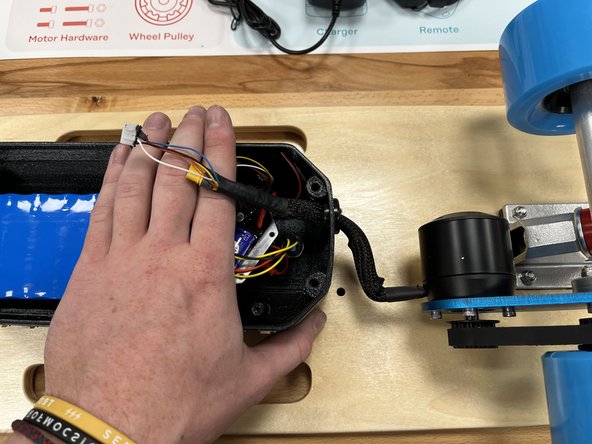 The photo shows a rubber grommet on the enclosure, we removed them as they were causing issues.