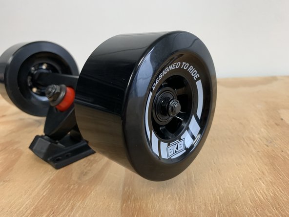 Place one wheel on each side with the letters facing outward