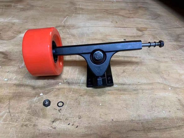 On the side that you just added the spacer to, place the wheel onto the truck