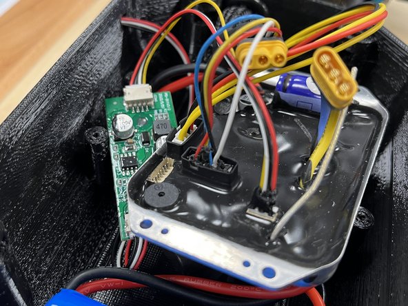 Plug the white connector from the motor into Port 2