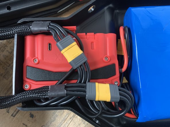 To attach the enclosure you will need to fold all of the wires flat and ensure the large yellow connectors are laying flat as well.