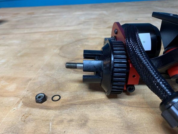 Slide the wheel pulley onto the truck as shown