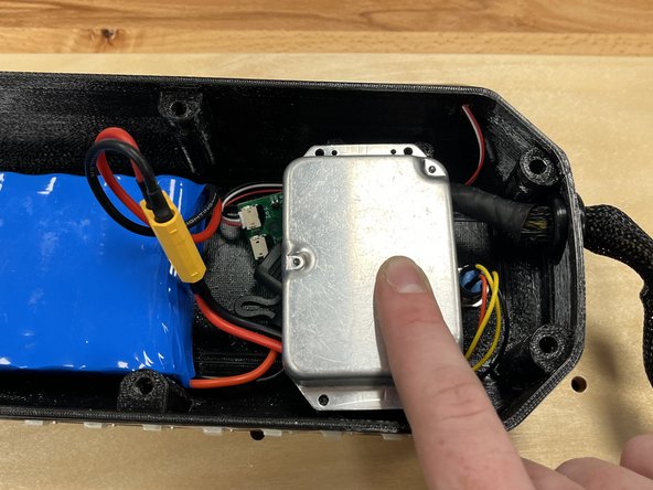 Flip the ESC over and rearrange the wires to fit the ESC onto the 4 plastic tabs