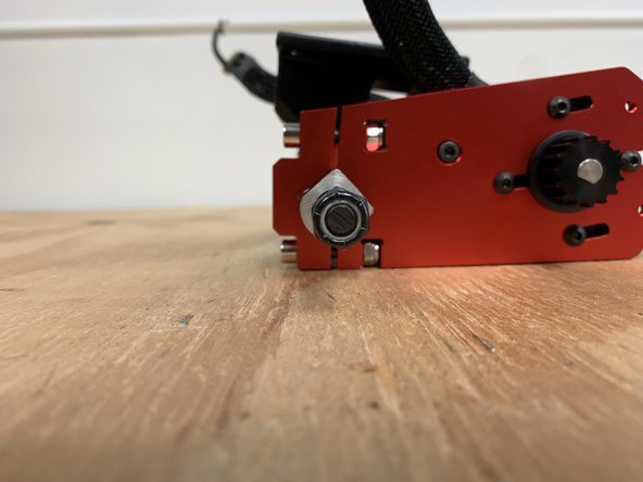 Tighten the bolts on the motor mount evenly. You should turn each bolt 1/4 to 1/2 a turn at a time. Then tighten the other bolt 1/4 to 1/2. This ensures there is even pressure on each bolt