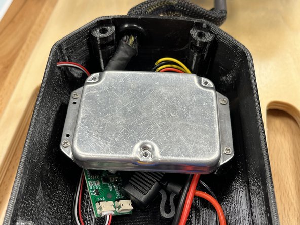 Use the 4x phillips screws and the screwdriver to secure the ESC to the enclosure