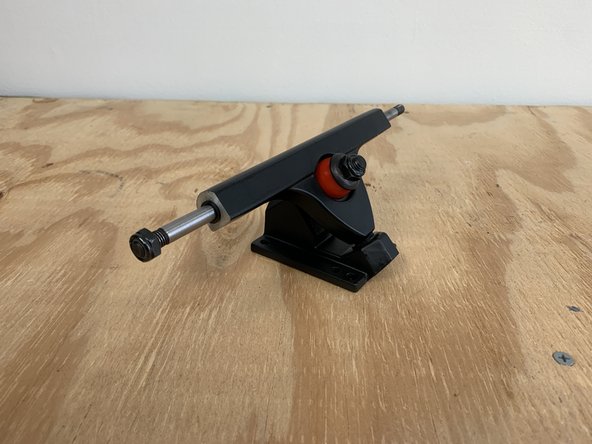 Place the bushing and washer back on and tighten the locknut