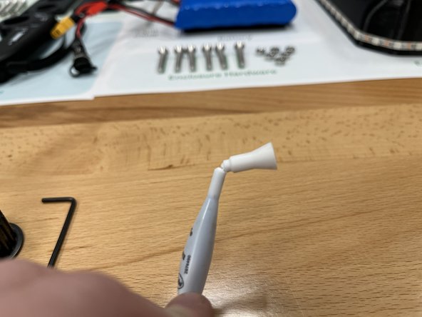 Open the loctite by breaking the top off as shown in the photo