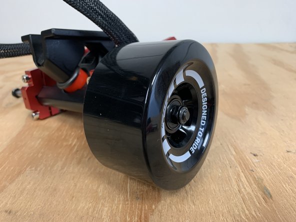 Add the washer and locknut back onto the truck. Tighten with the T Tool