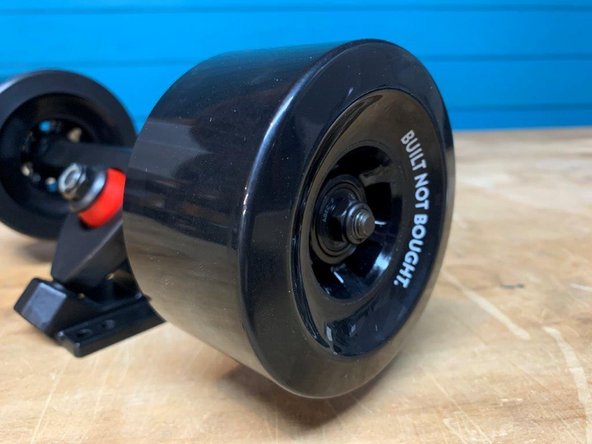 Place one wheel on each side with the letters facing outward