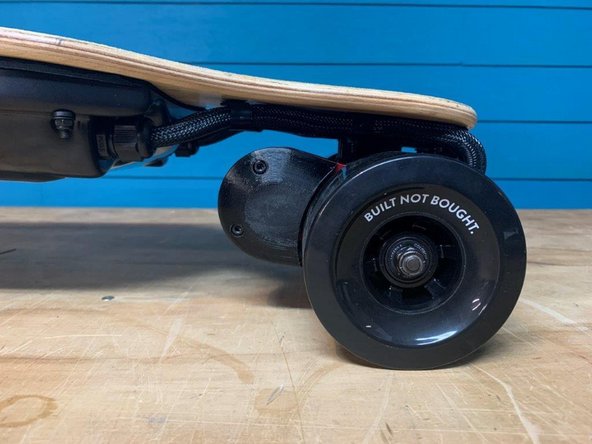 Place the belt guards on the motor mounts and tighten the four screws