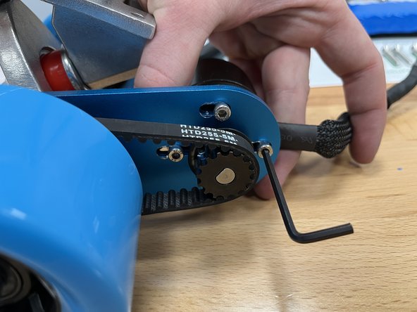 Once the bolt heads are almost to the rear of the slots, tighten one of the bolts