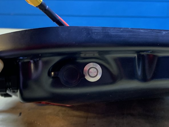 The switch and charge port have now swapped positions